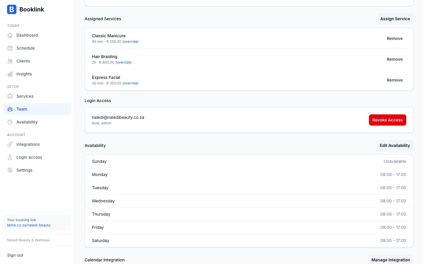 The assigned services tab on a team member profile showing a list of services with optional overrides